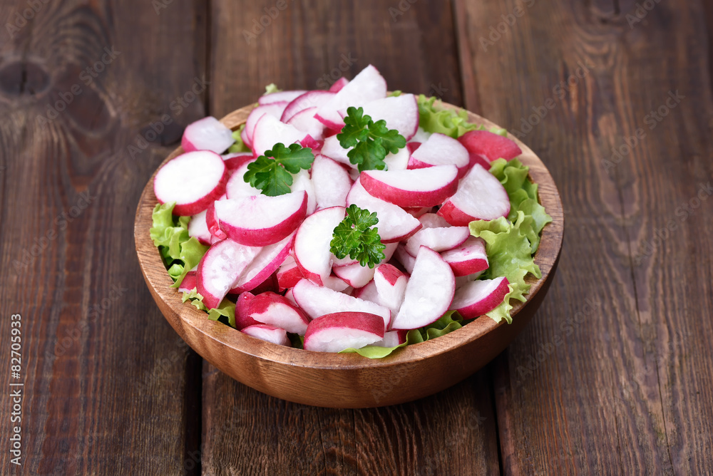 Radish salad on wooden table