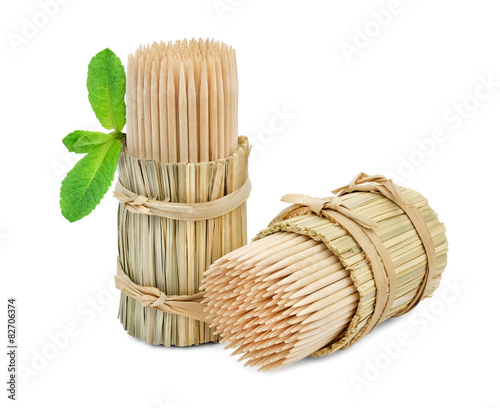 Toothpicks in packs of straw and a mint.