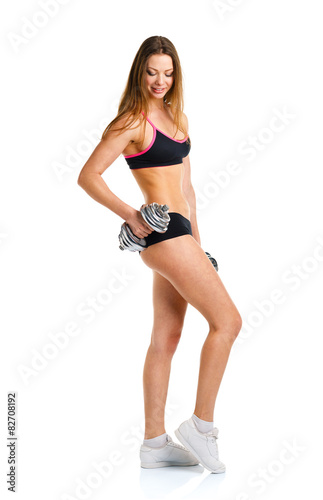 Beautiful sport woman with dumbbells doing sport exercise, isola