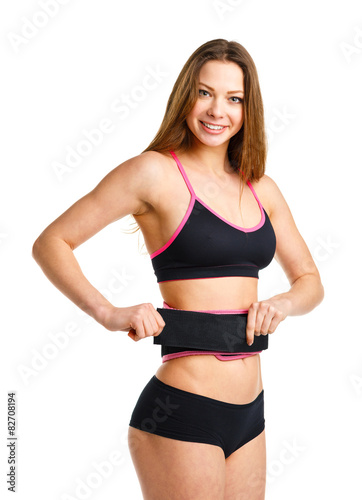 Happy athletic woman doing sport exercise, isolated on white