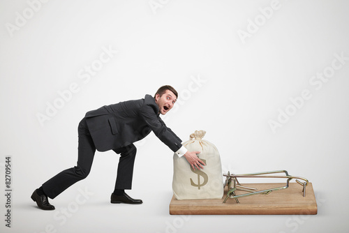 Vászonkép man reaching his hands to take bag