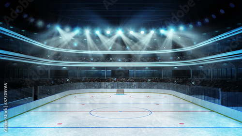 hockey stadium with spectators and an empty ice rink photo