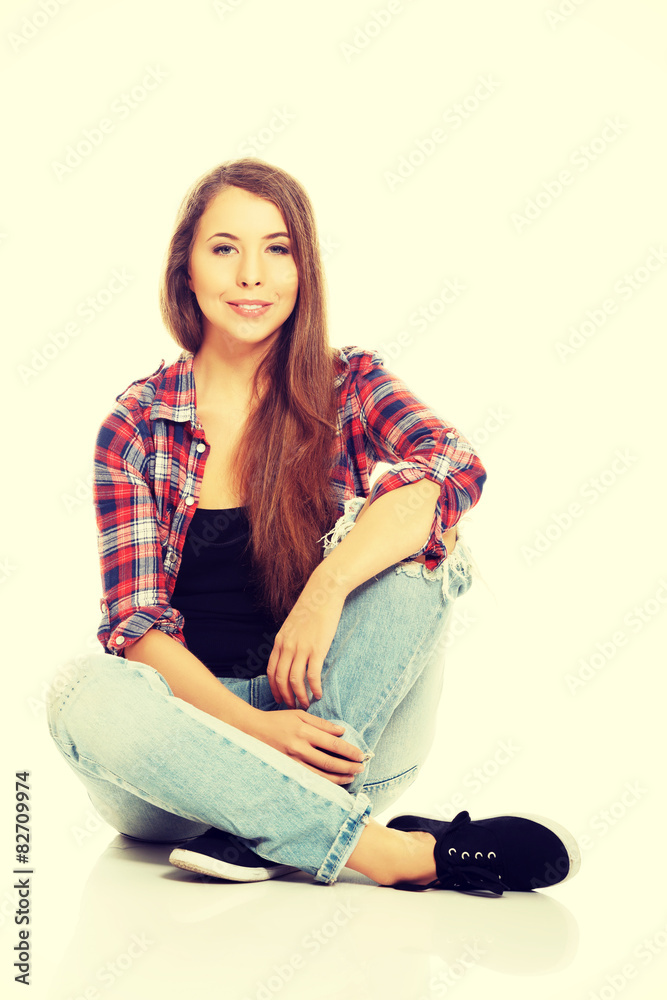 Fototapeta premium Woman sitting cross-legged