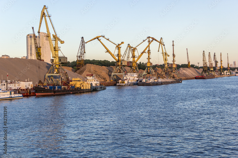 barges and cranes in river port