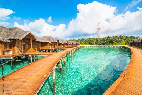 Over water bungalows with steps into amazing green lagoon © theyok