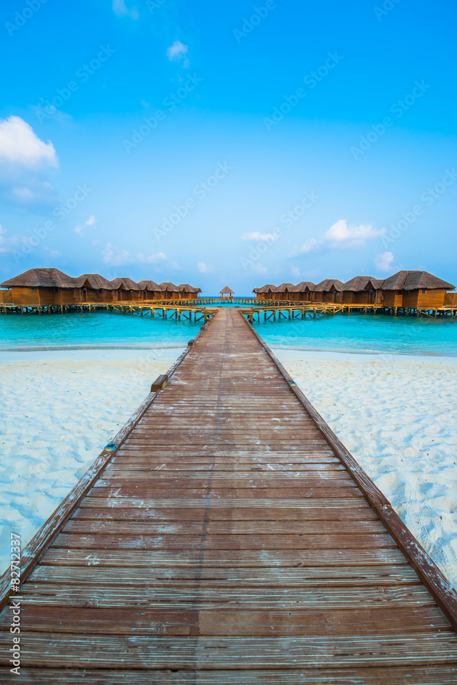 Over water bungalows with steps into amazing green lagoon