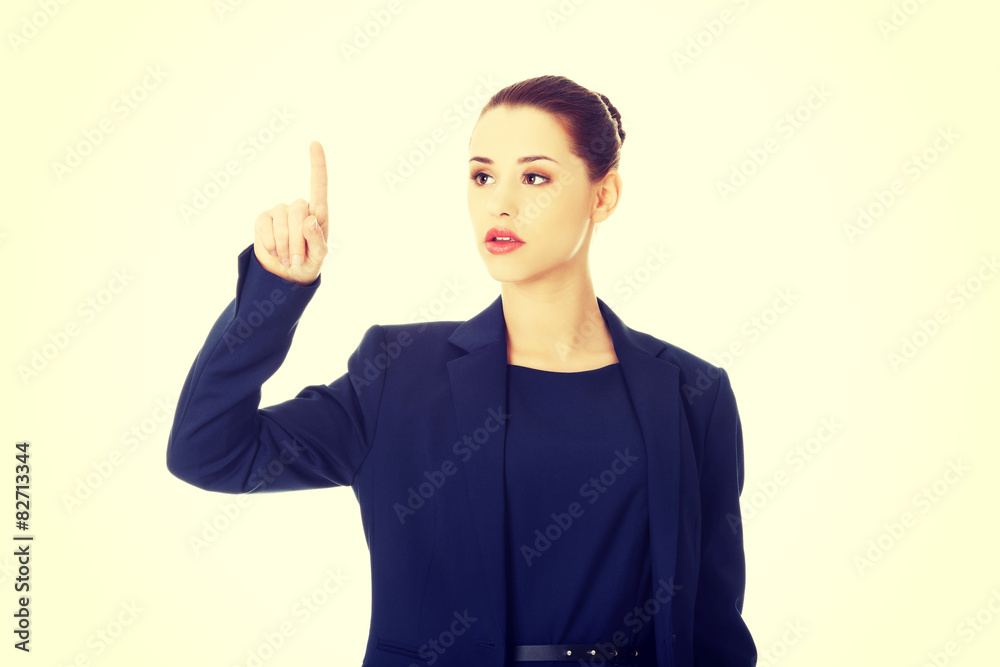 Businesswoman pointing by a finger Businesswoman pointing by a finger
