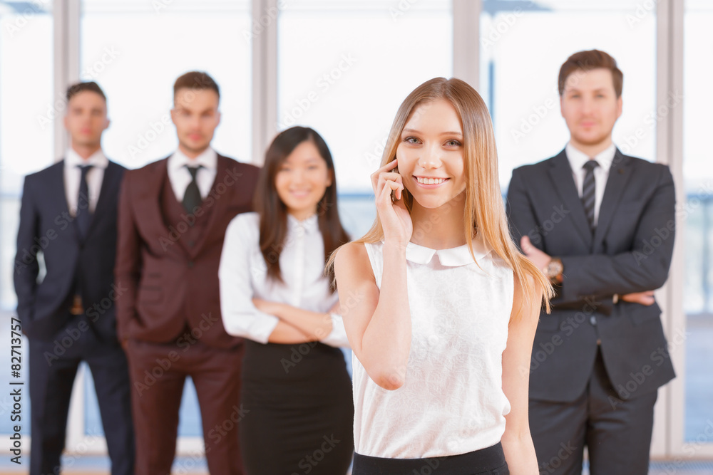 One of businesswoman or businessman standing in the foreground a One of businesswoman or businessman standing in the foreground a