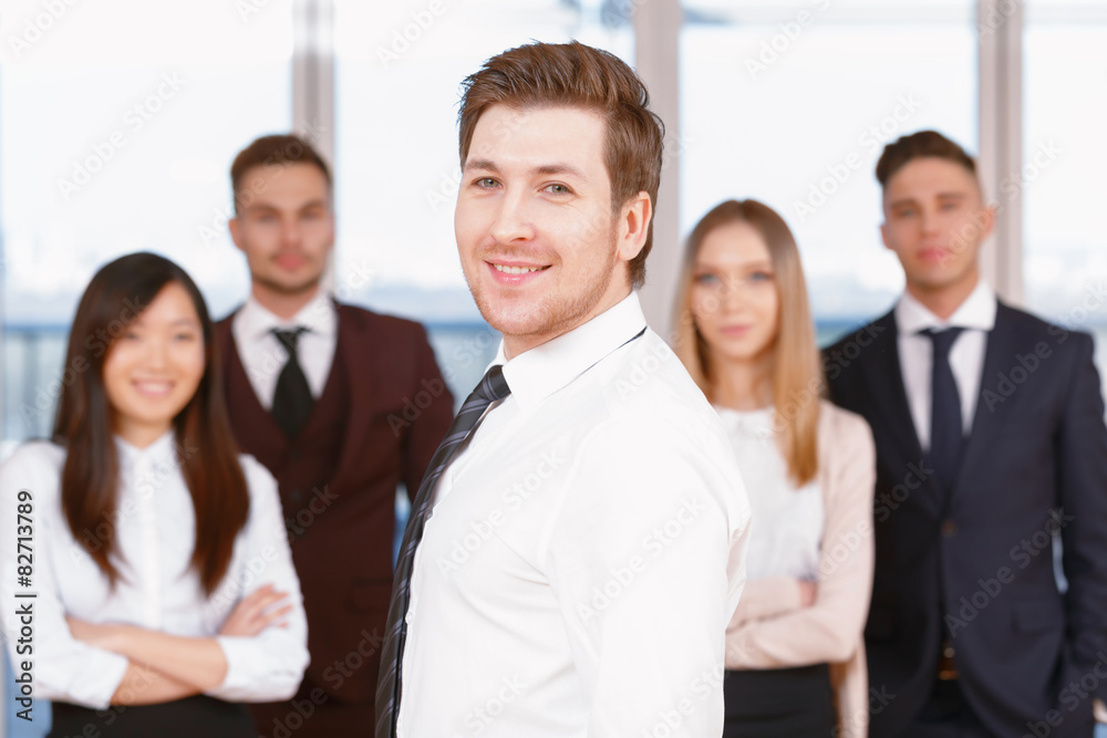 One of businesswoman or businessman standing in the foreground a One of businesswoman or businessman standing in the foreground a