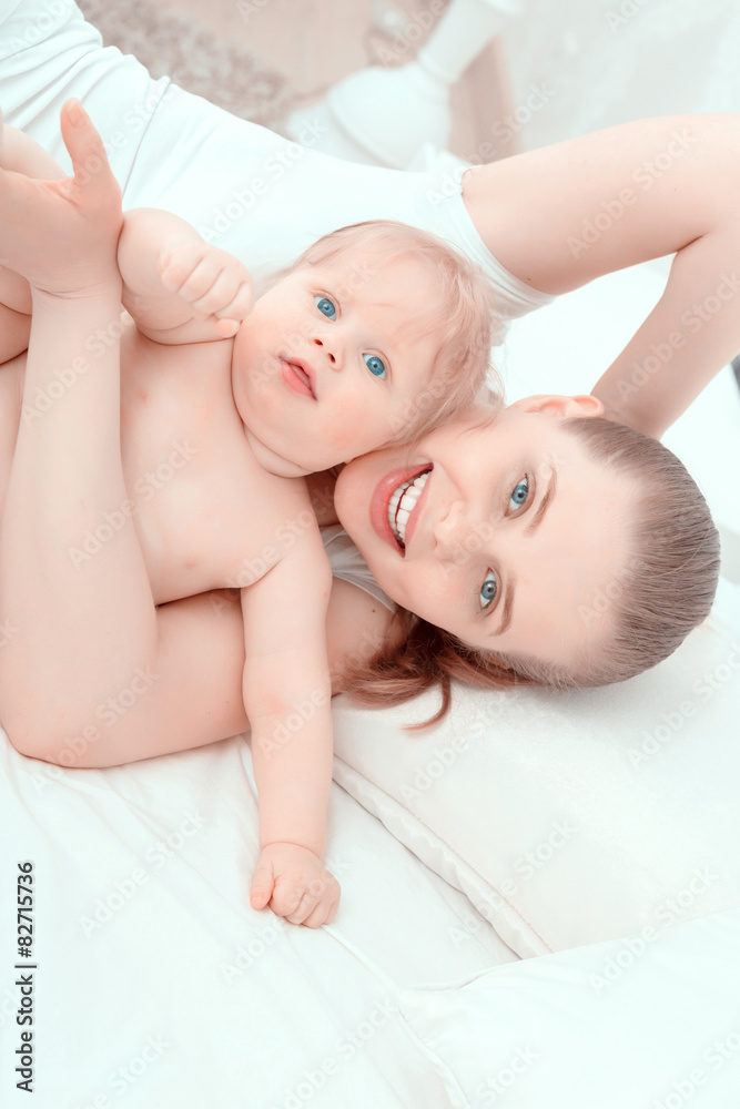 Mother and her little baby on the bed Mother and her little baby on the bed
