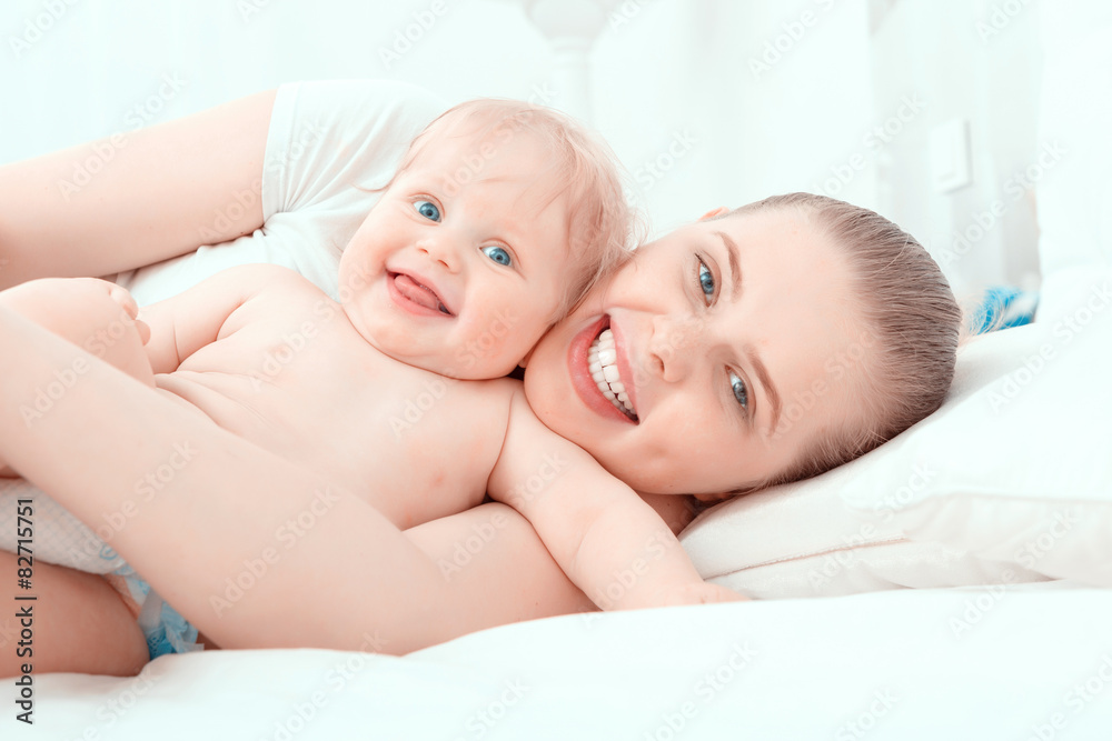 Mother and her little baby on the bed Mother and her little baby on the bed