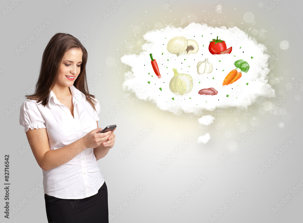 Pretty woman presenting a cloud of healthy nutritional vegetable Pretty woman presenting a cloud of healthy nutritional vegetable