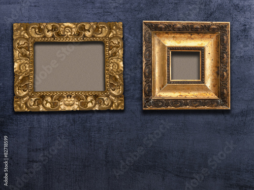  two gold frame black wall