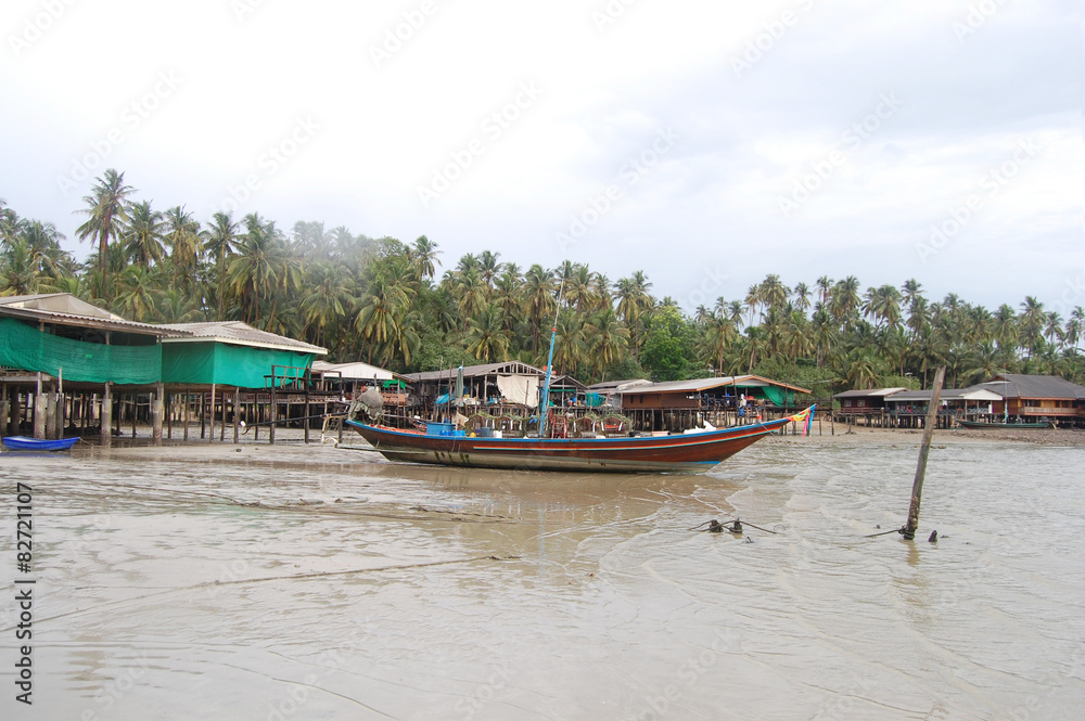 Boat floating while storm raining at Fishing village