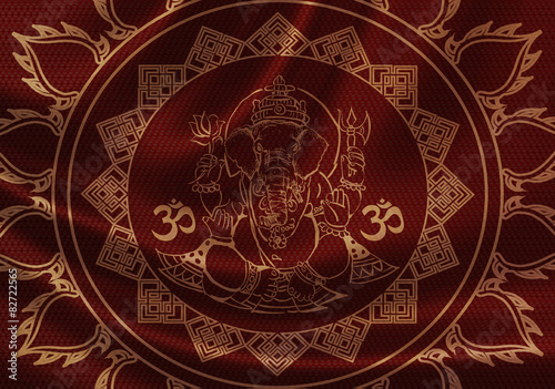 an image of Ganesha, symbol of OM on red cloth