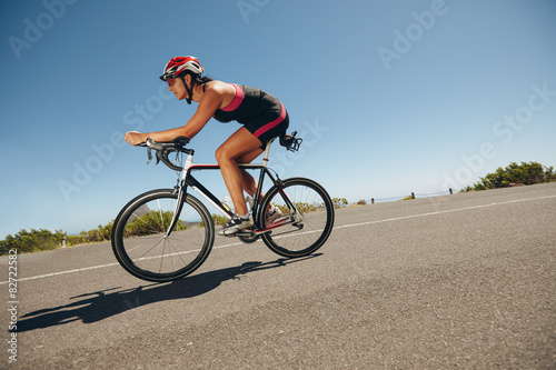 Female cyclist on a country road