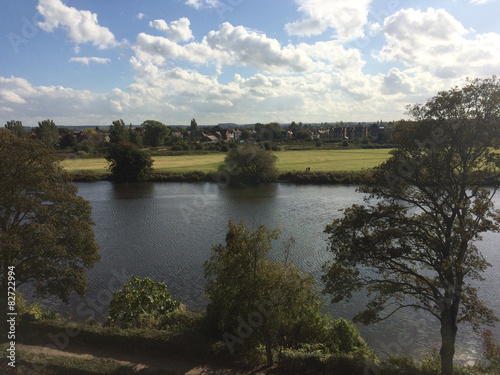 Midday end summer sunny day with clouds over river Trent