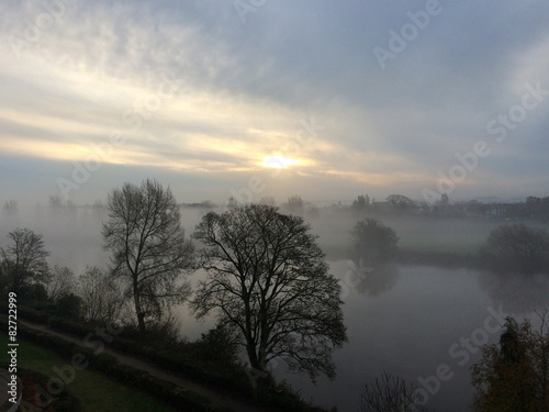 Sunrise through a foggy start of the day over the river Trent © bopob