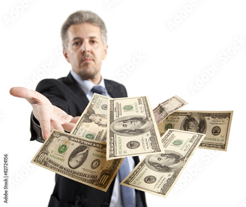 Businessman throwing dollar