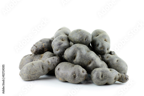 Vitolette noir or purple potato. On a white background photo