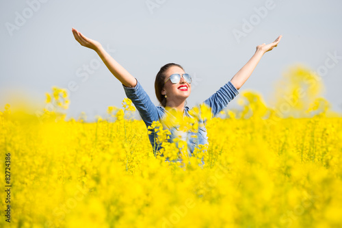 Woman cheering in the rape field