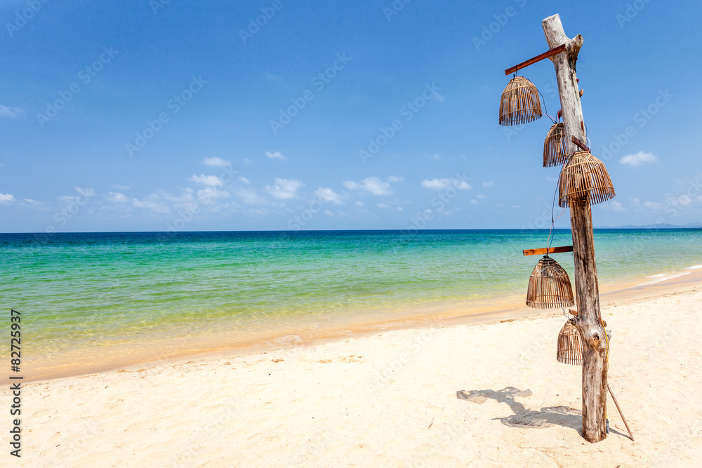 Wooden lantern on a tropical beach