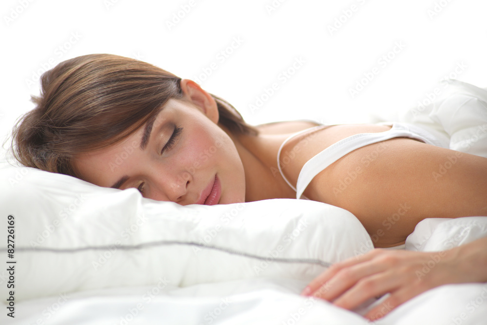 Beautiful girl sleeps in the bedroom, lying on bed Beautiful girl sleeps in the bedroom, lying on bed