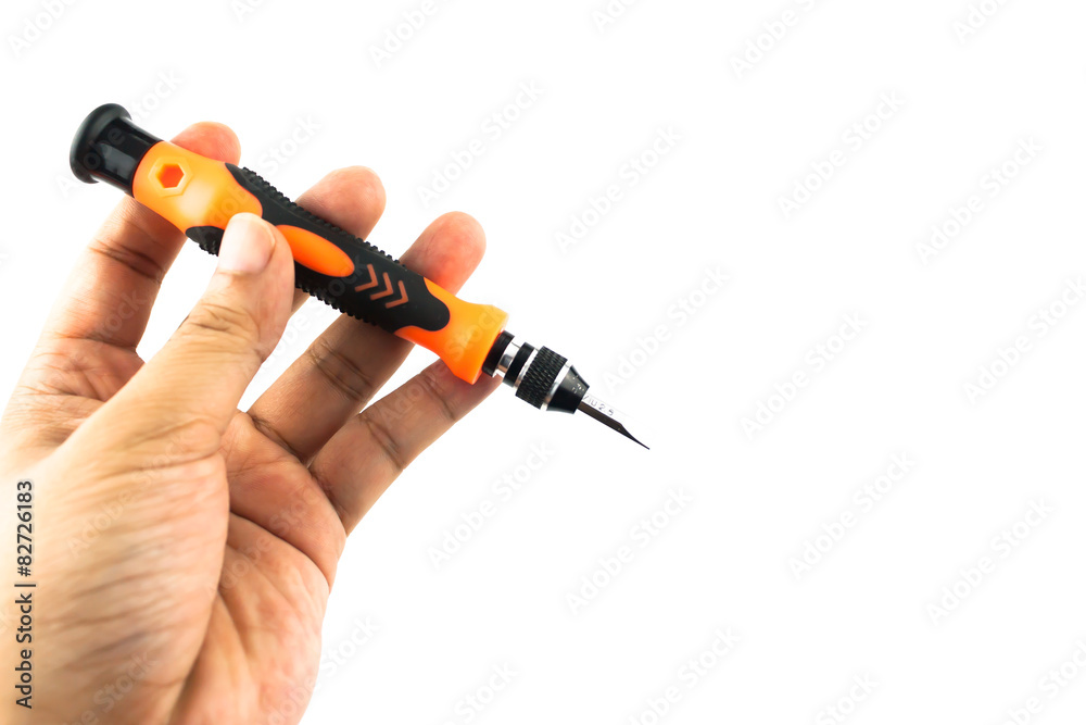 Naklejka premium hand holding screwdriver isolated