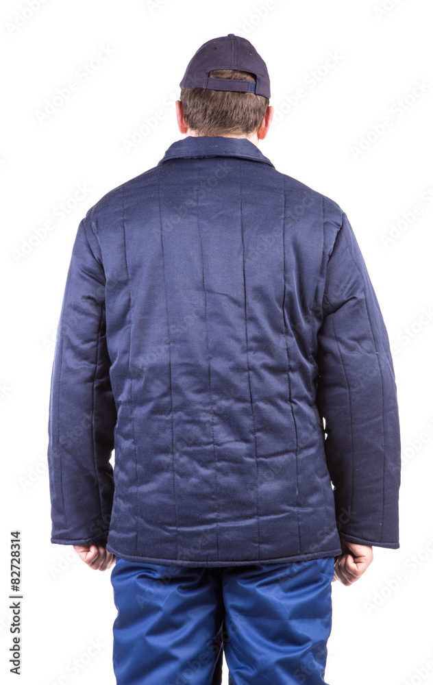 Worker in winter workwear. Back view. Worker in winter workwear. Back view.