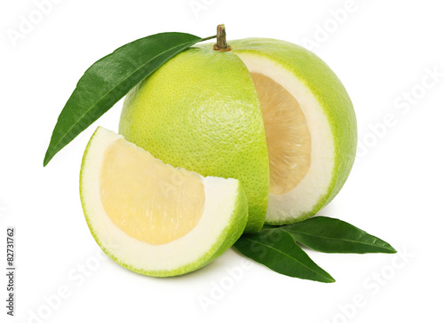 Ripe sliced sweetie with green leaves (isolated) photo