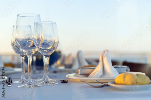Dinner plate in restaurant with wine glasses