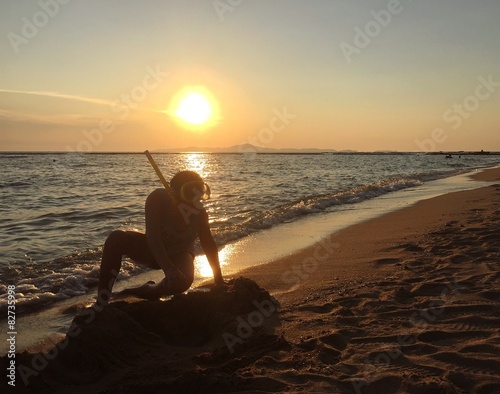 boy with snorkel on beach.  © apitsada