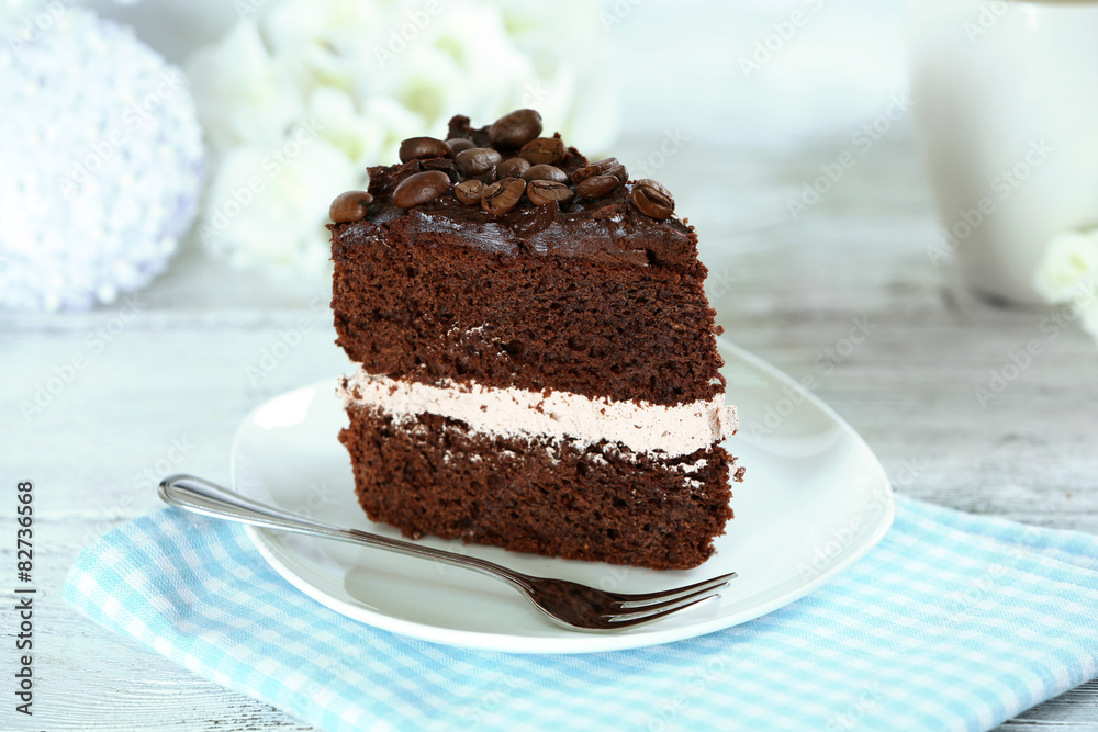 Delicious chocolate cake on table on light background Delicious chocolate cake on table on light background