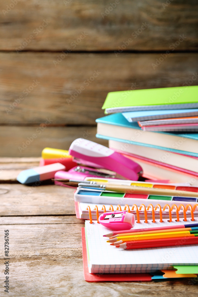 Obraz premium Bright school stationery on old wooden table