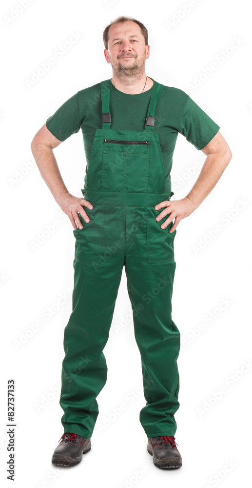 Worker in green overalls.