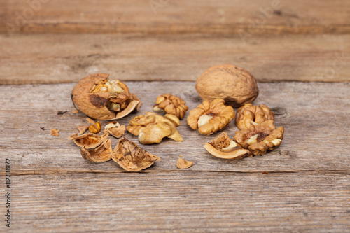 Raw Organic Walnuts on rustic old wooden table