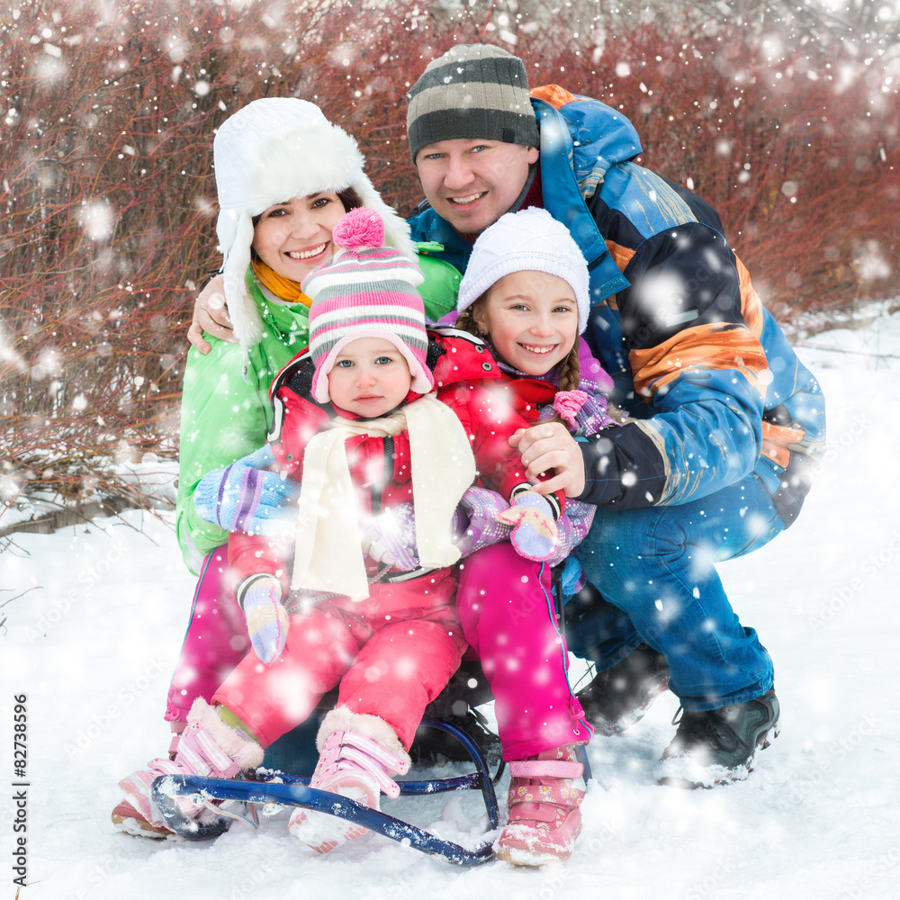 Winter portrait of happy young family
