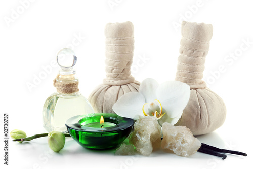 Composition with massage bags  sea salt and orchid flower  isolated on white