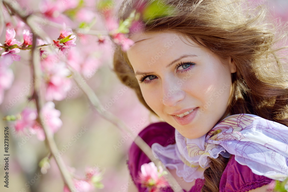 Naklejka premium young woman portrait outdoor in spring