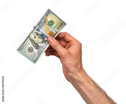 Hand takes 100 dollar bill