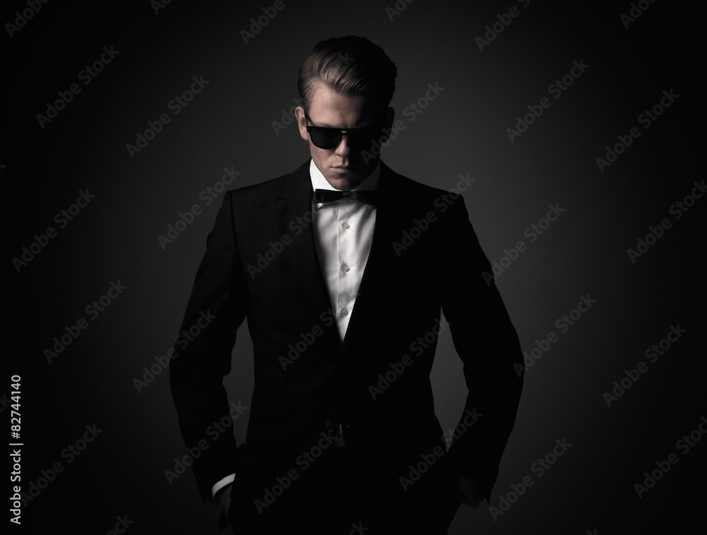 Confident sharp dressed man in black suit Confident sharp dressed man in black suit