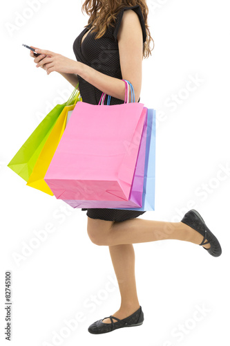 Shopping woman with her cell phone