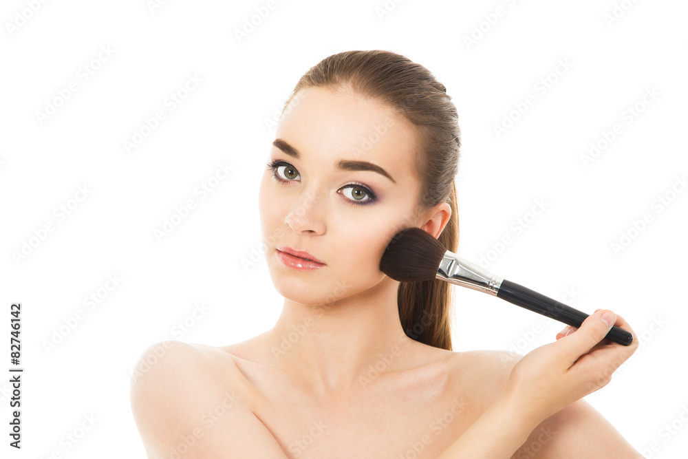 beautiful girl does make-up with brush beautiful girl does make-up with brush