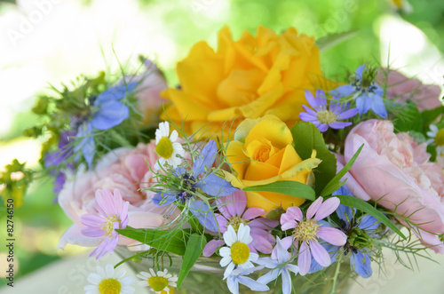 rose and herbal flowers in arrangement