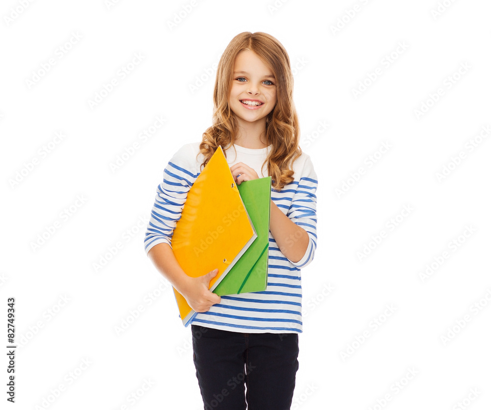 child holding colorful folders child holding colorful folders
