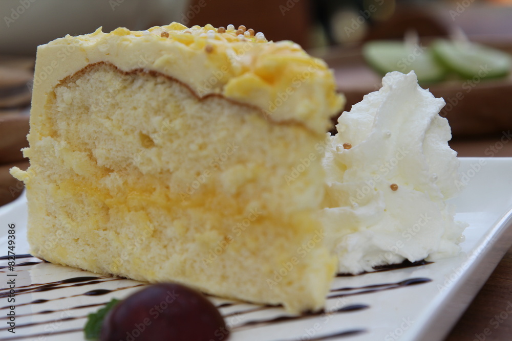 Yellow lemon cake with on white plate Yellow lemon cake with on white plate