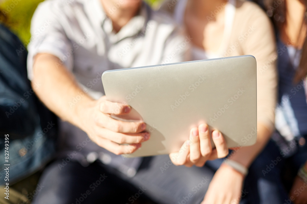 close up of friends with tablet pc taking selfie