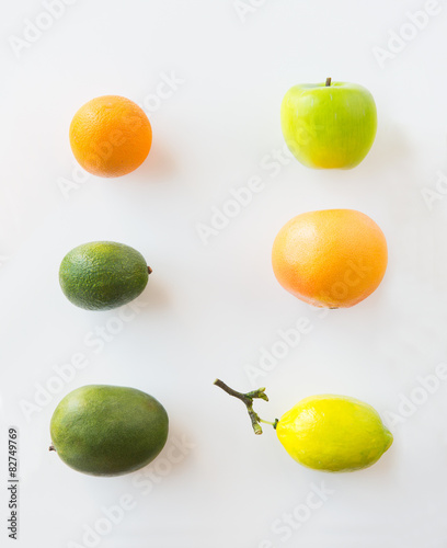 ripe fruits and vegetables over white