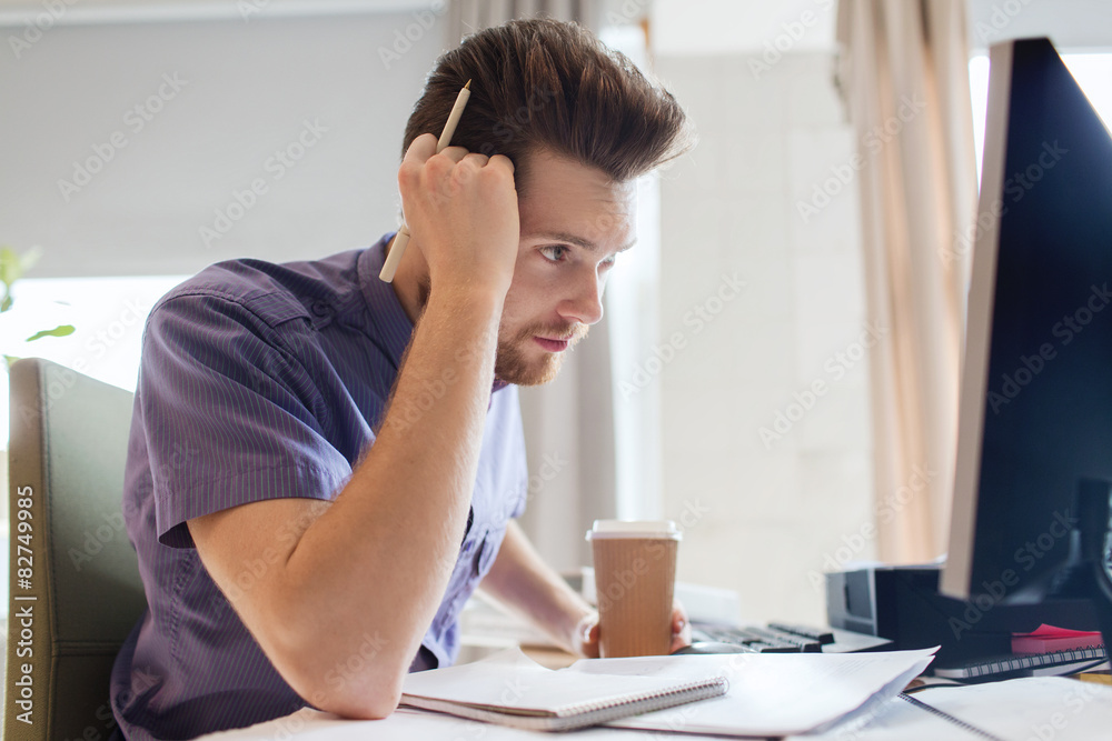 creative male office worker with coffee thinking creative male office worker with coffee thinking