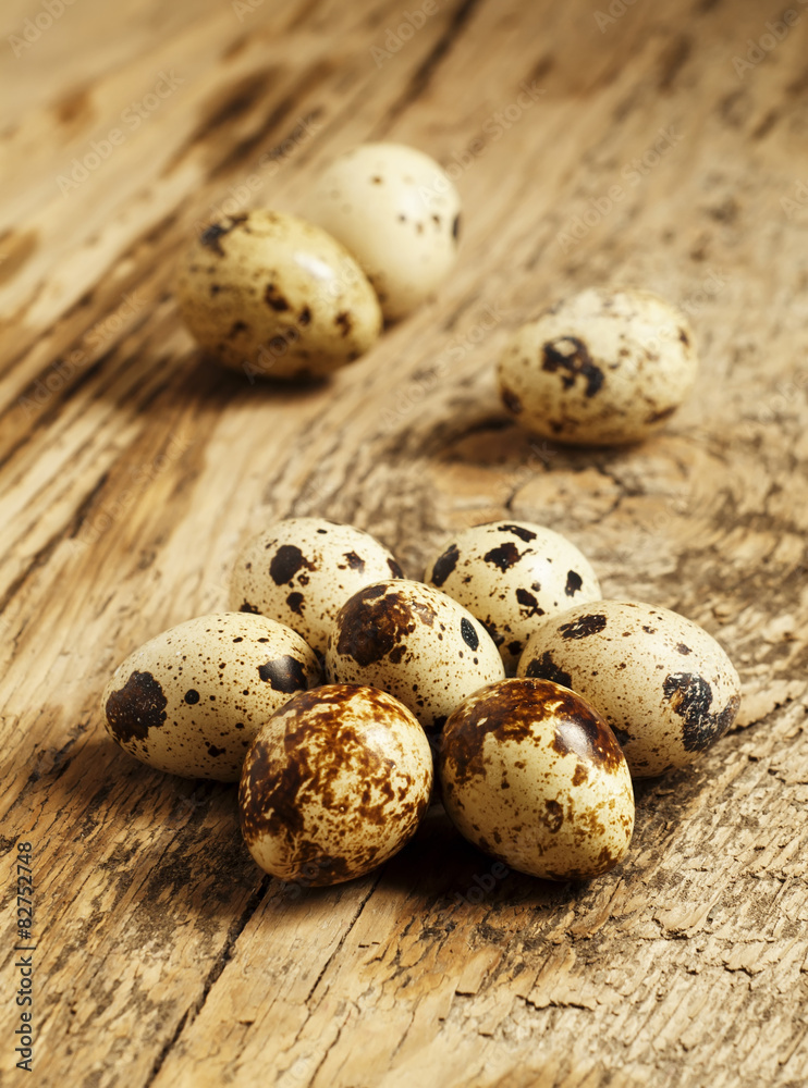 Quail eggs on a wooden table, selective focus Quail eggs on a wooden table, selective focus